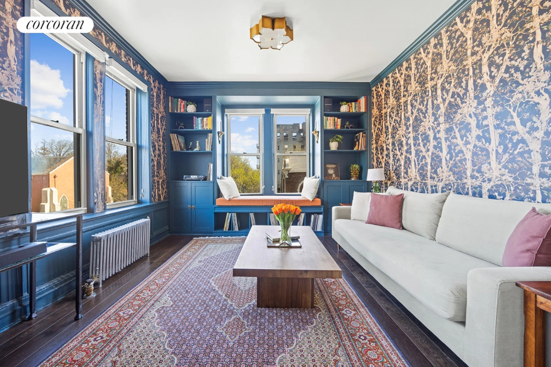 Teal living room in a Brooklyn unit